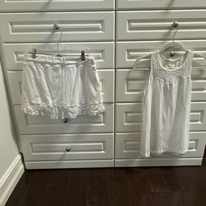 2 Sofibella white tennis outfits that are gently used. Both are size L.